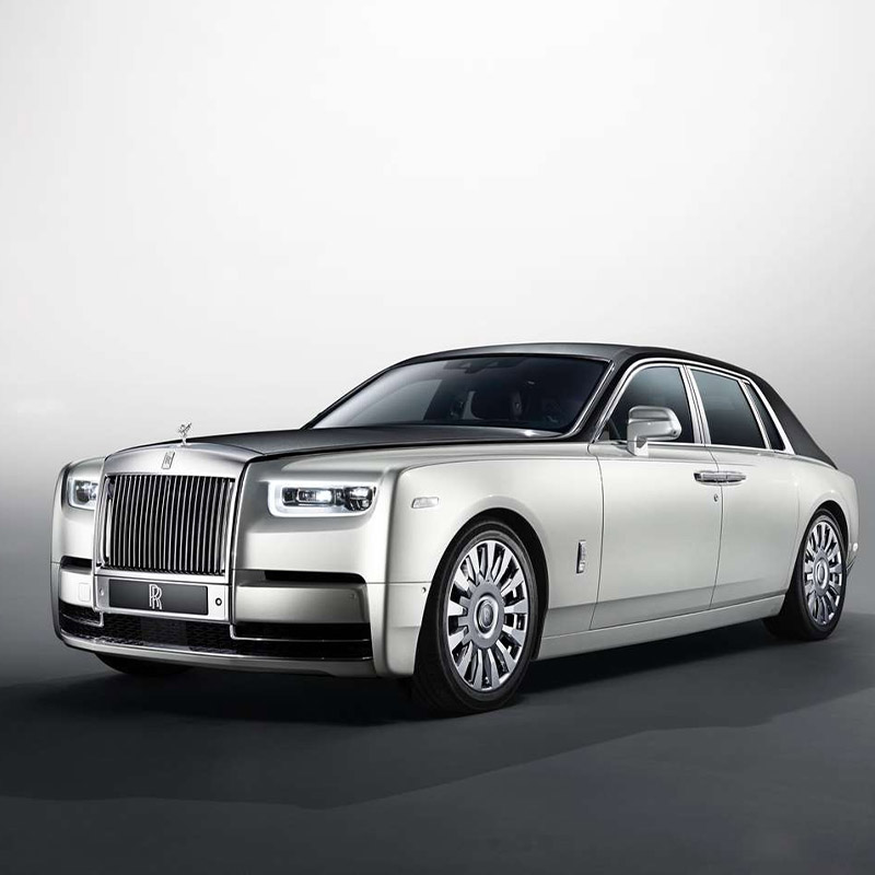 front side view of white Rolls-Royce Phantom on a white studio background
