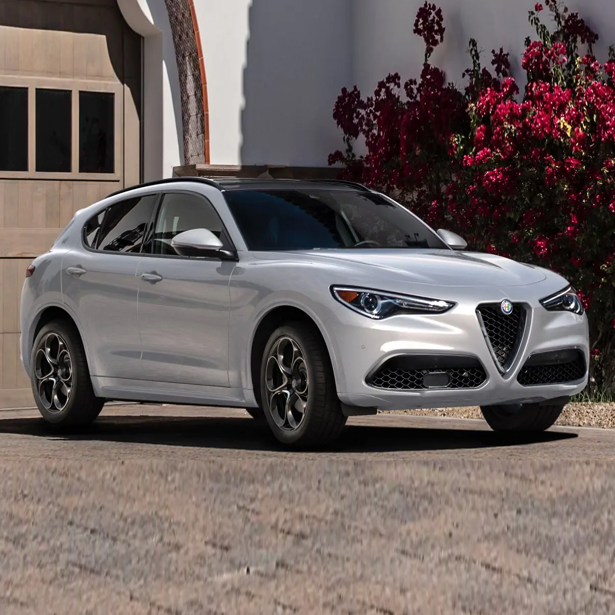 2021 Alfa Romeo Stelvio parked in front of a house